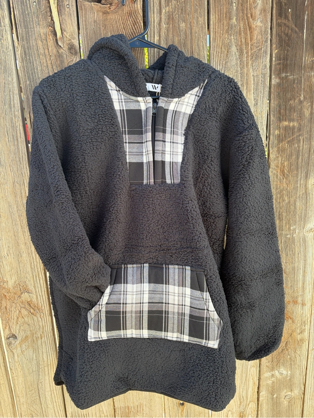 Black Sherpa Hoodie with Black-and-White Plaid Accents